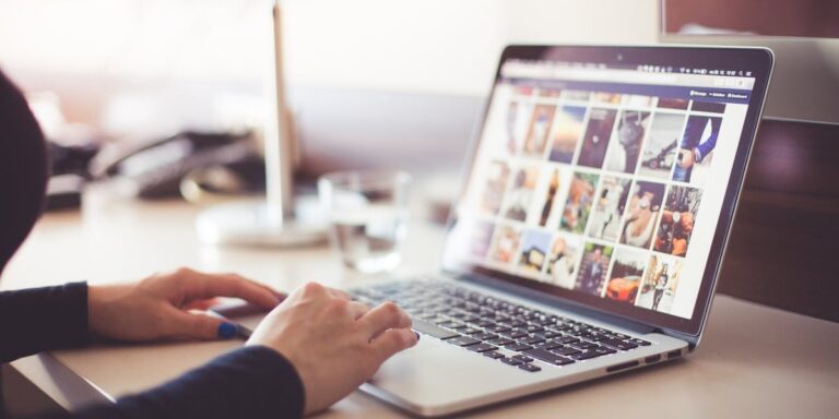 A person at a computer looking at social media