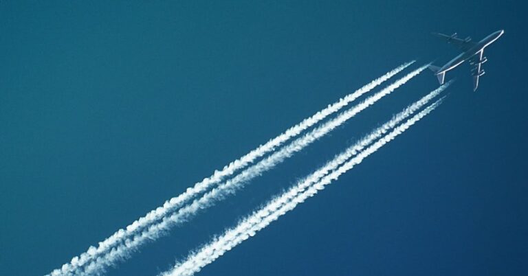 contrails of an airplane crossing the sky
