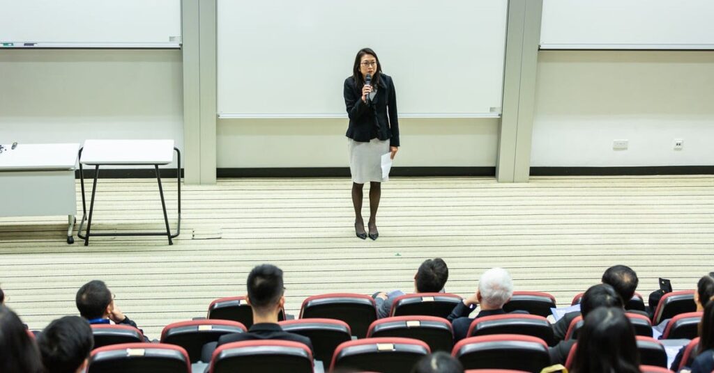 instructor in front of a lecture hall