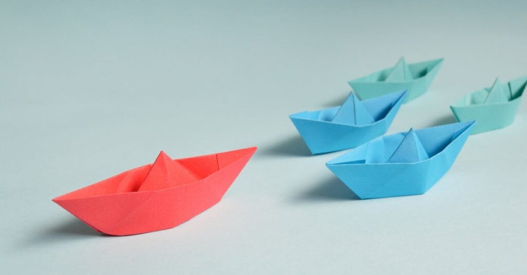 leader of a fleet of paper boats