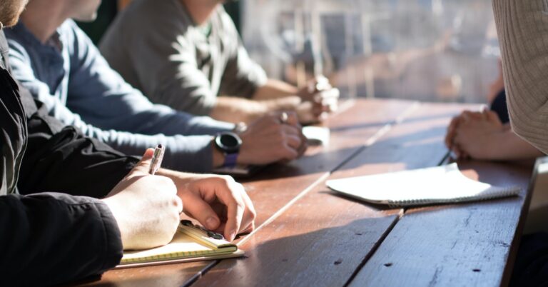 learners sitting together around a table