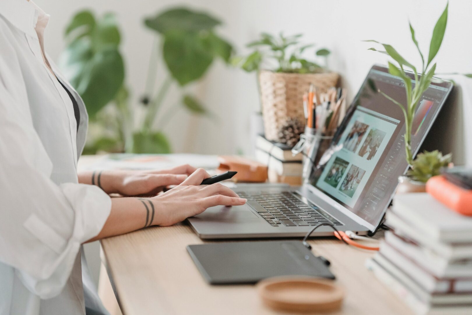 person working on a laptop and creating a storyboard