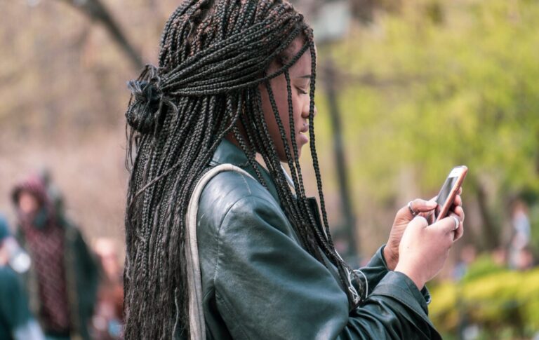 person using phone outside